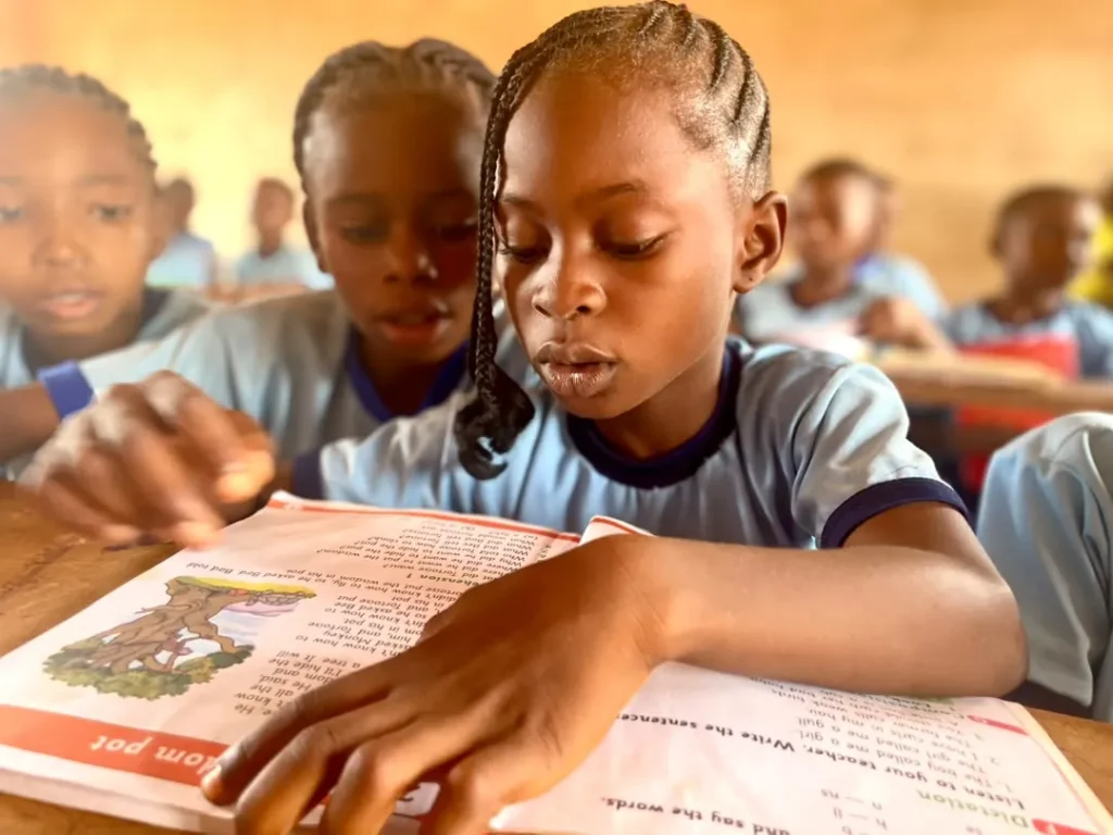 A pupil reading in class