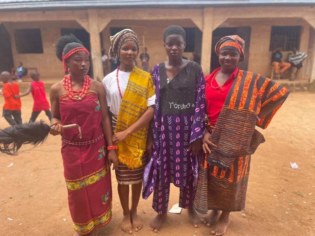 Students in traditional attire at Flying Eagles